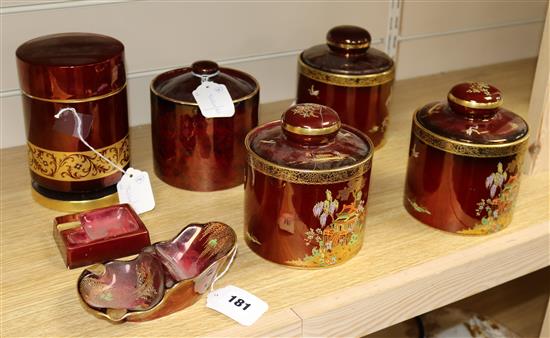 Five Carlton Ware Rouge Royale chinoiserie-decorated tobacco jars (3 Dunhill, 1 a.f), a pipe rack and an ashtray (7)